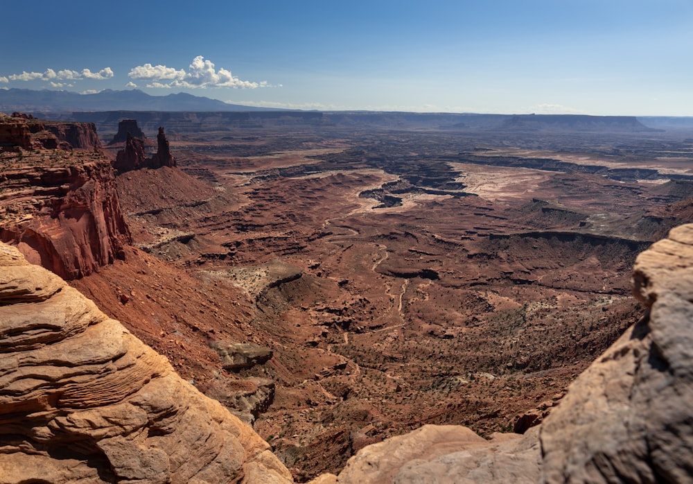 aerial photography of brown mountain under clear blue sky