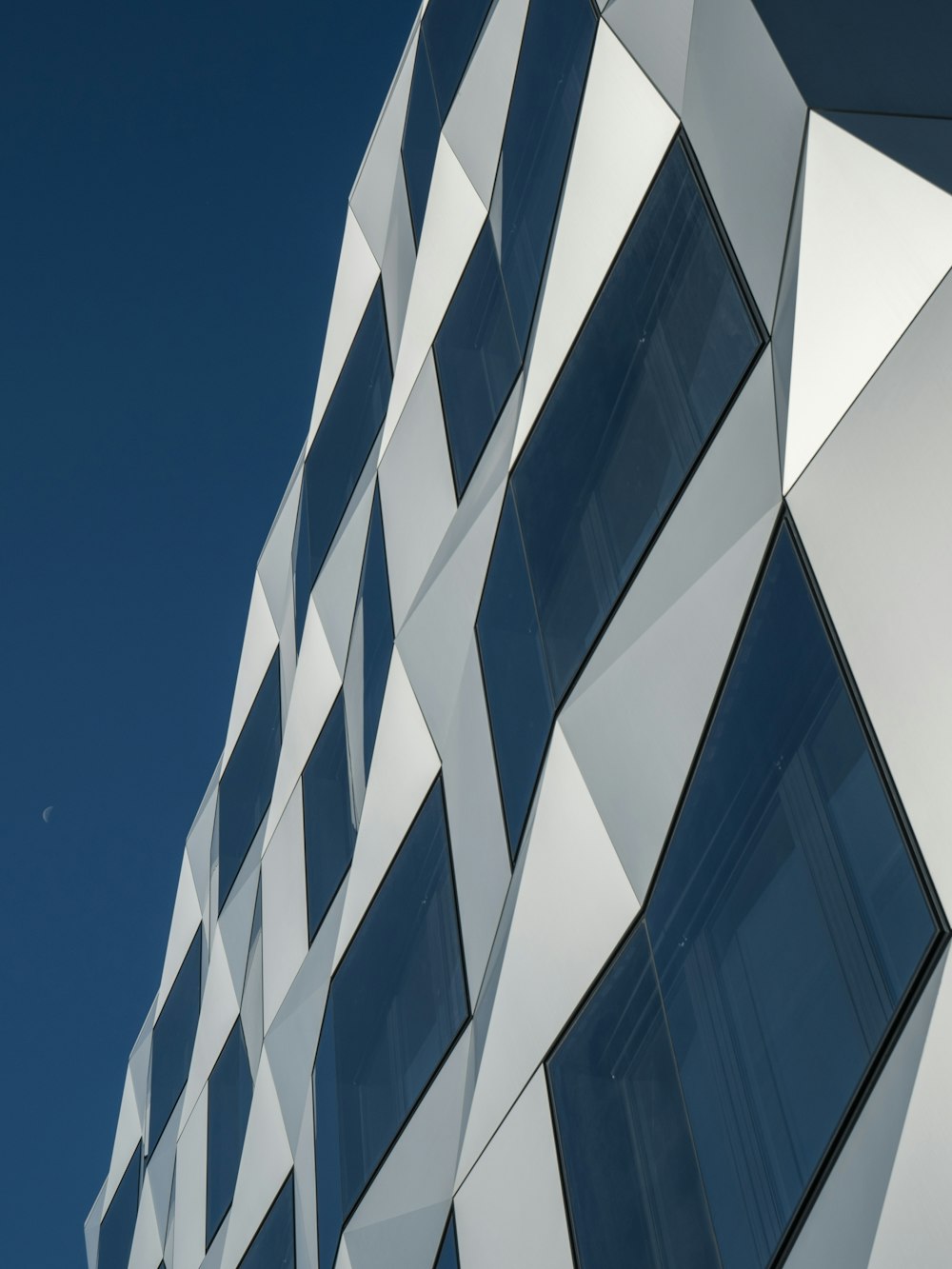architectural photography of a blue glass building