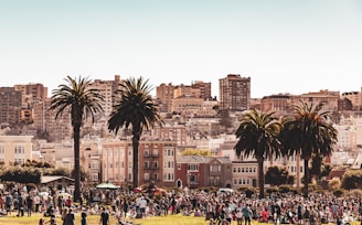 An overhead drone image of a bustling city park filled with people.