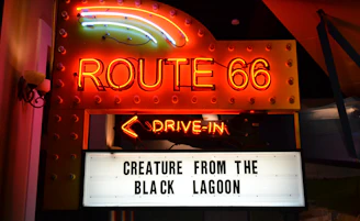 The iconic Fork Union Drive-In marquee lit up against a starry sky, inviting all to movie night.