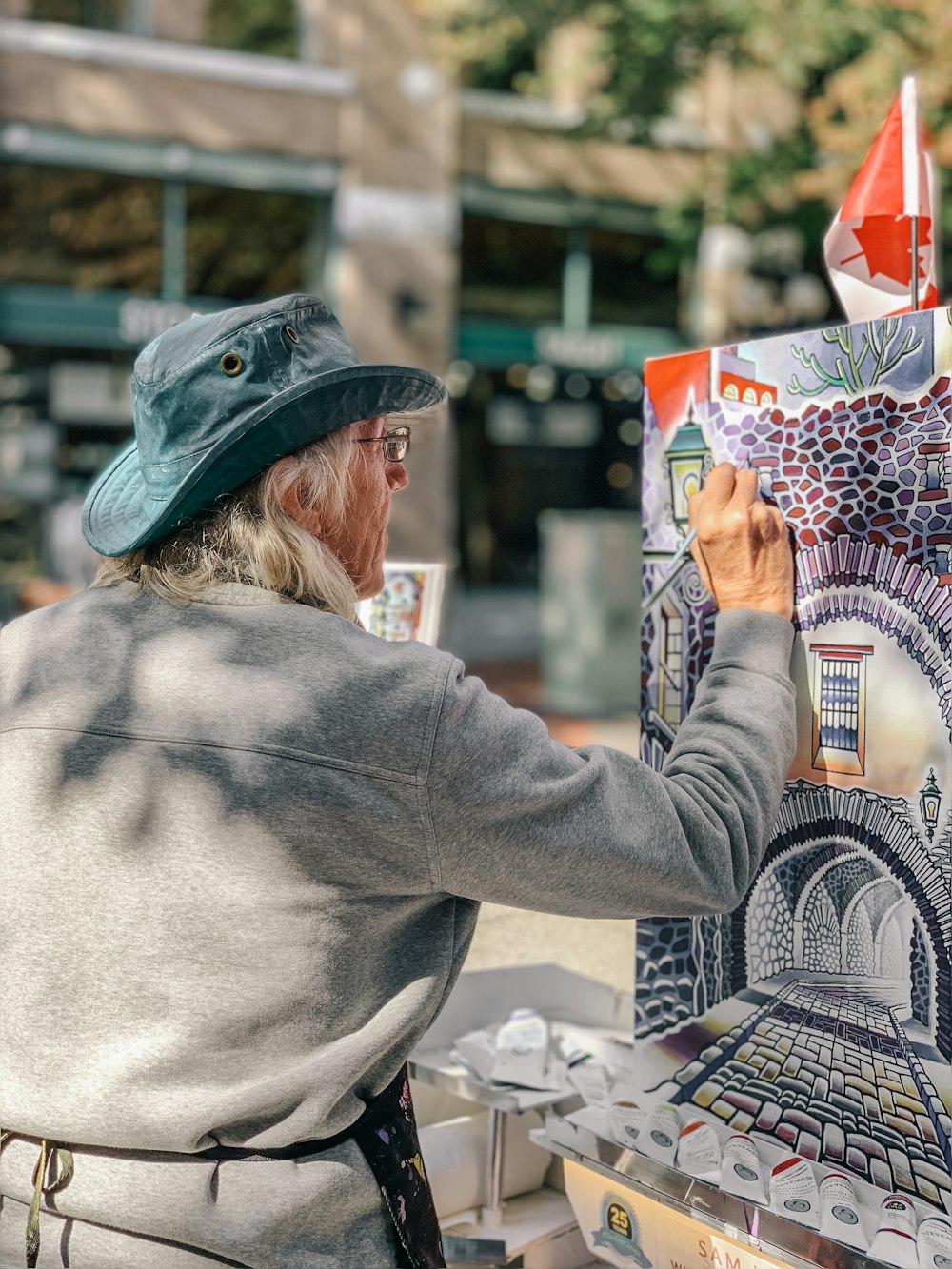 man painting building