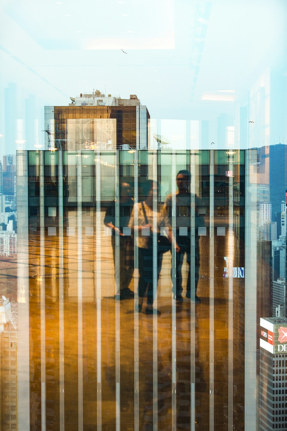 three person walking inside building