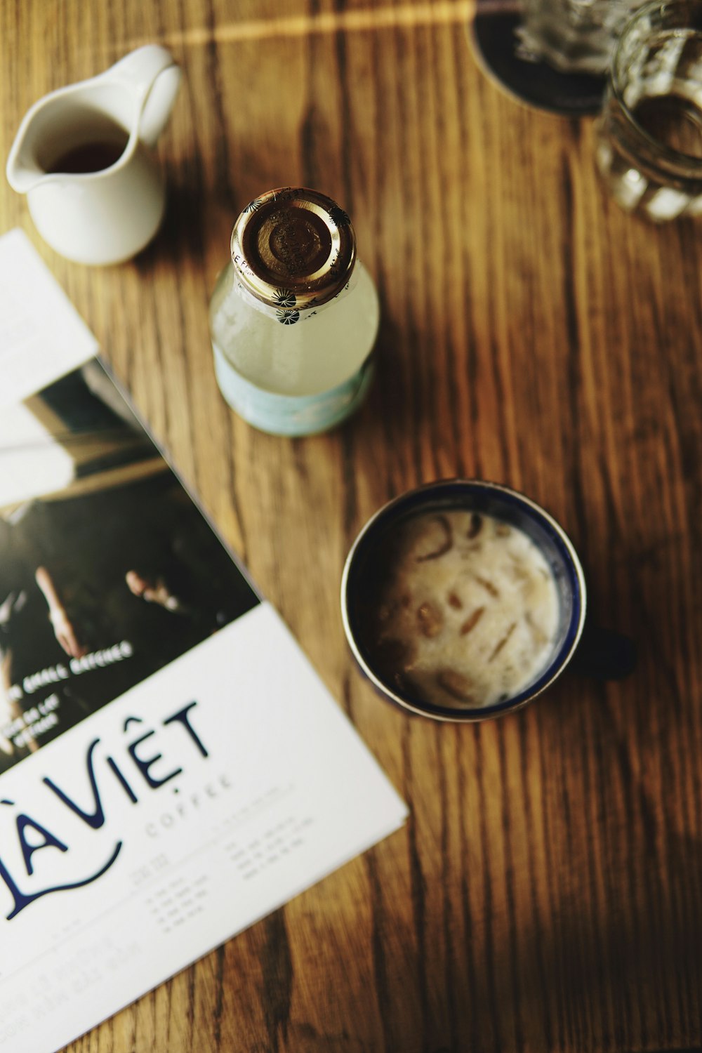 brown liquid in cup on table