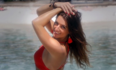 A sun-kissed woman enjoying a beach day.