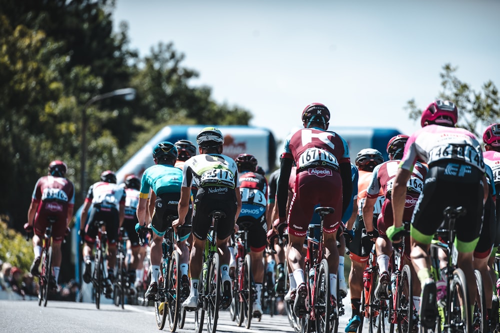 a group of people riding bikes down a street