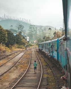 person standing on train track