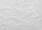 a white painted wall with white paint on it