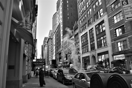 grayscale low angle photo of building in Manhattan United States