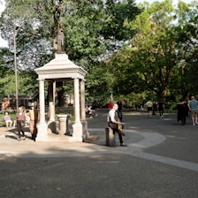 A serene park scene with individuals engaging in charity activities.