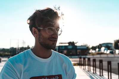 A candid lifestyle portrait of a person enjoying a sunny day in the city.