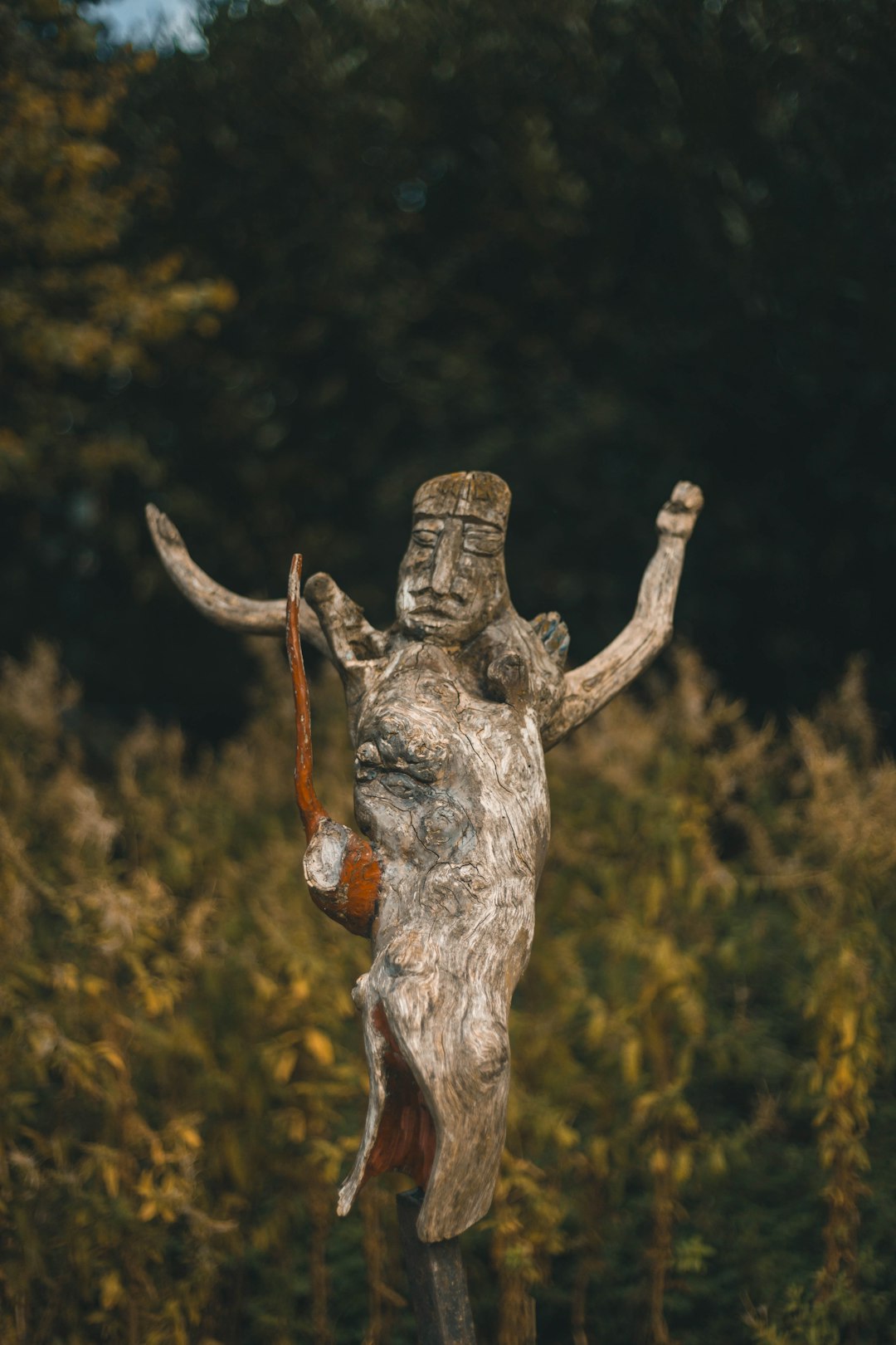 statue in open area rug