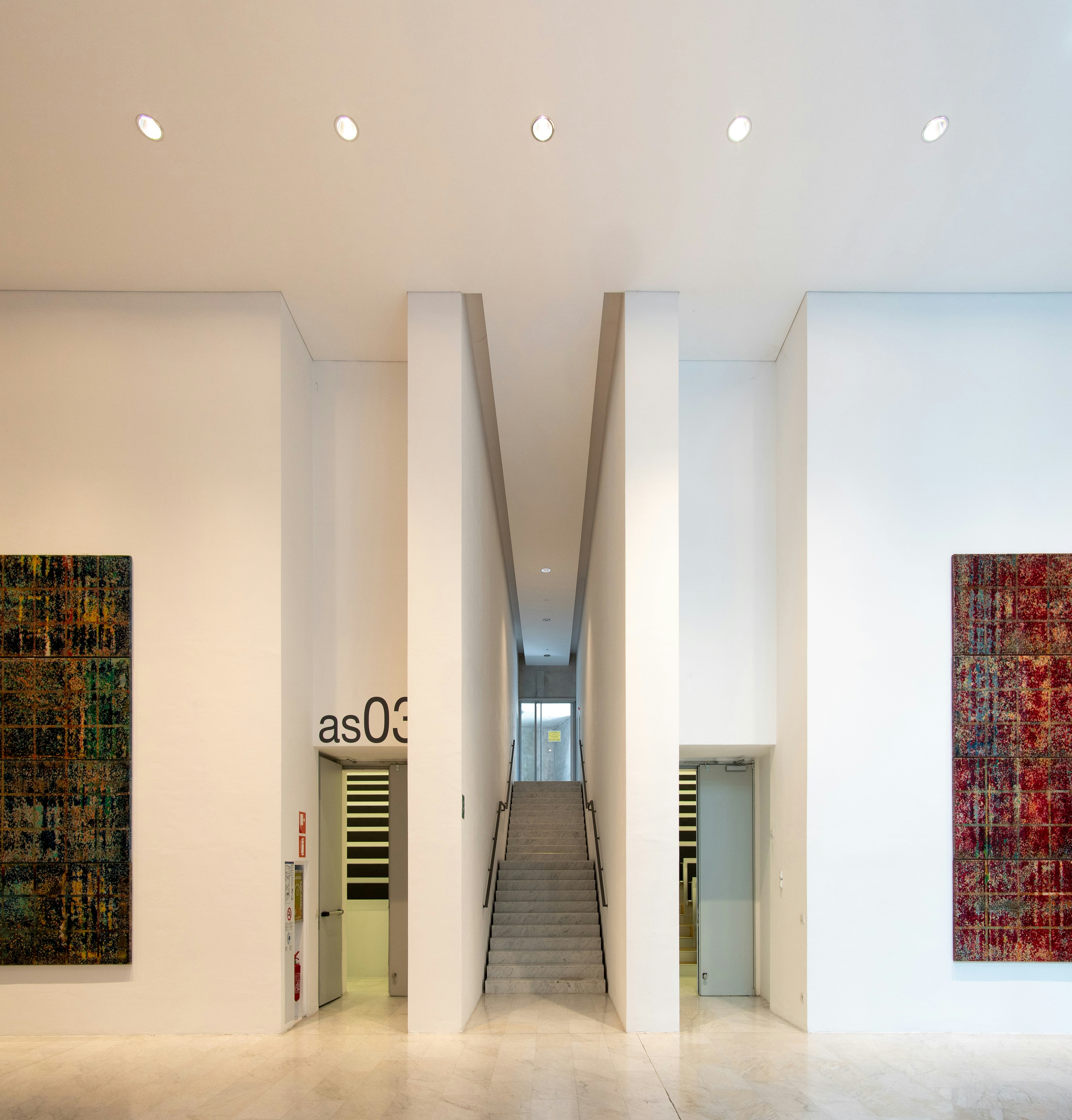 gray stair between two doors