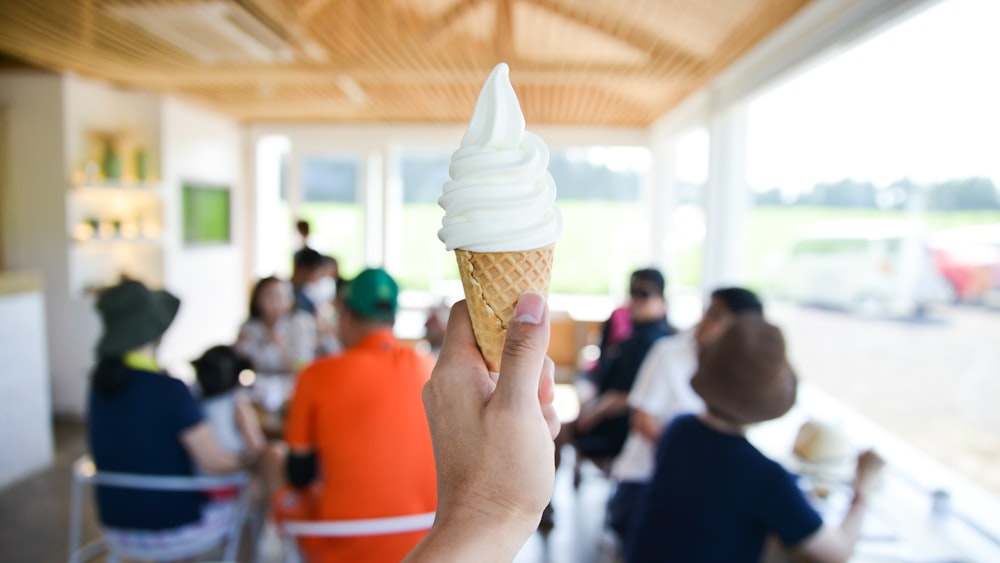 person holding ice cream