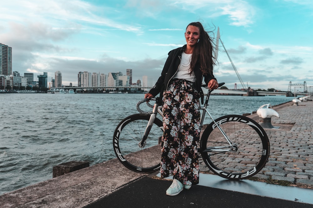 woman leaning on bicycle