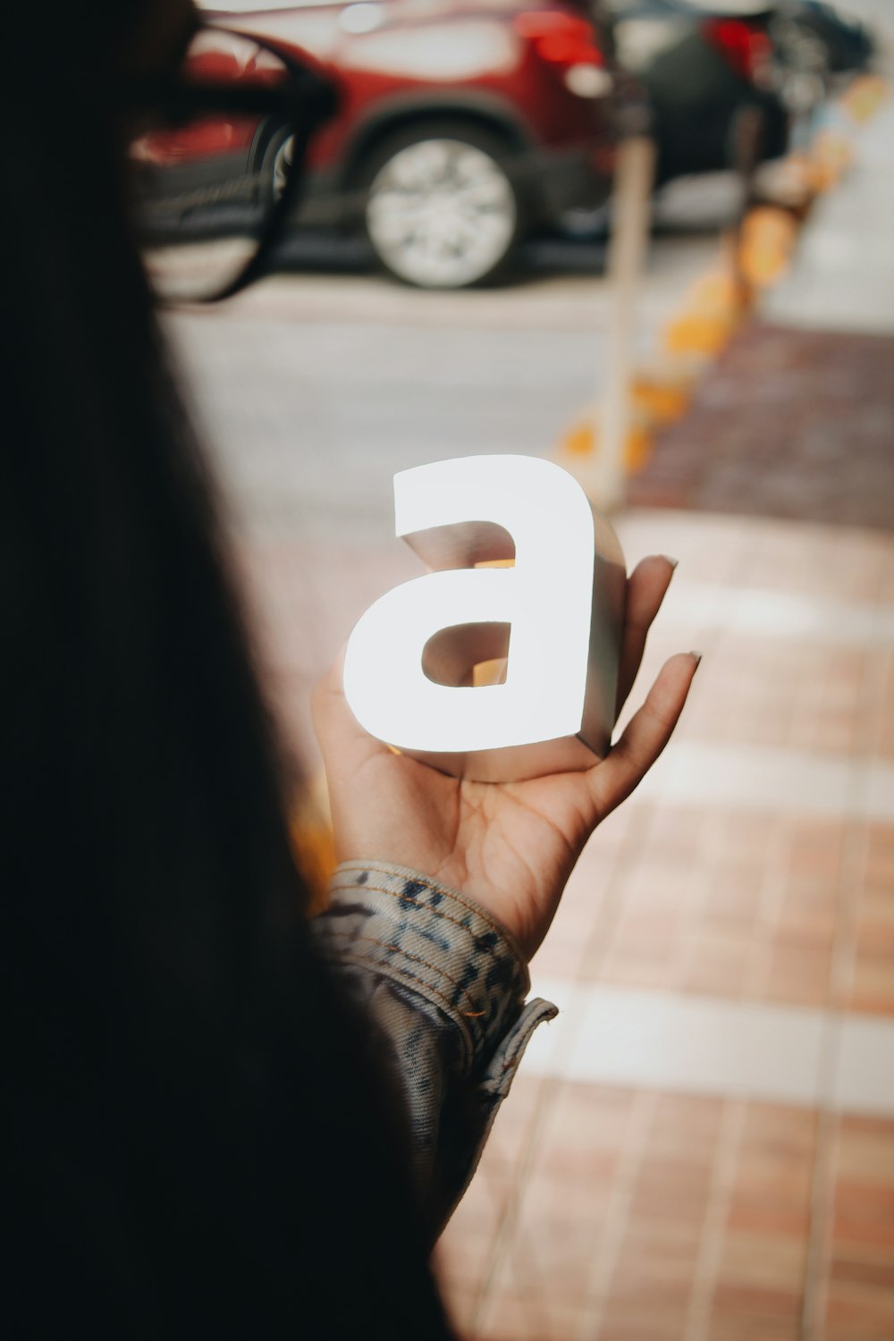 woman holding a standee