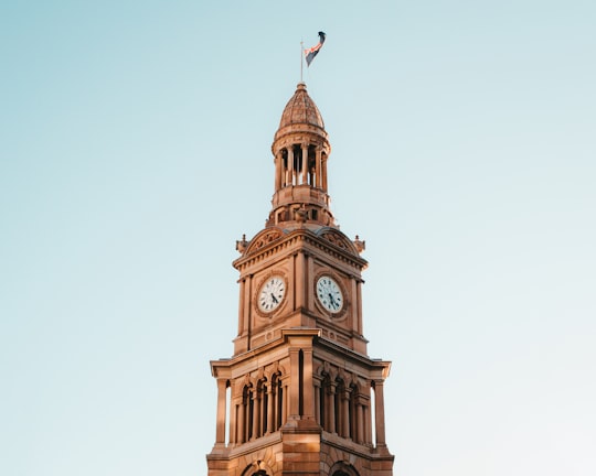 brown clock tower in Sydney Town Hall Australia
