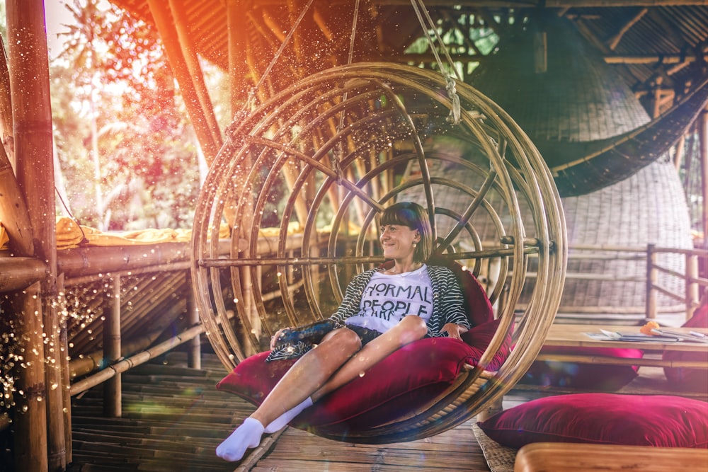 woman sitting on hanging chair