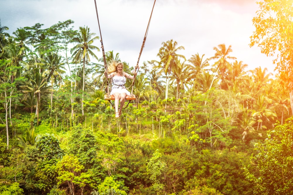 woman sitting on swing