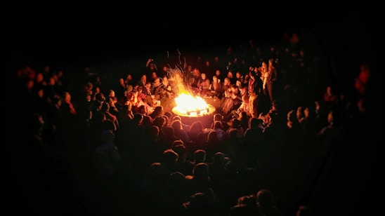 people gathering near bonefire