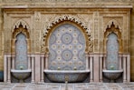 a decorative fountain in the middle of a courtyard