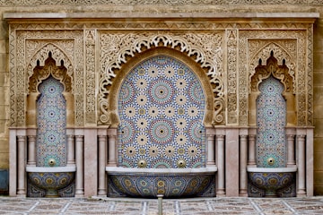 a decorative fountain in the middle of a courtyard