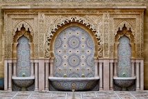 a decorative fountain in the middle of a courtyard