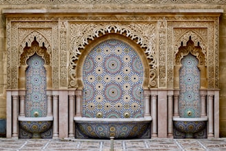 a decorative fountain in the middle of a courtyard