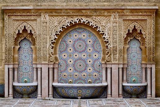 a decorative fountain in the middle of a courtyard