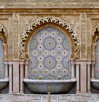 a decorative fountain in the middle of a courtyard