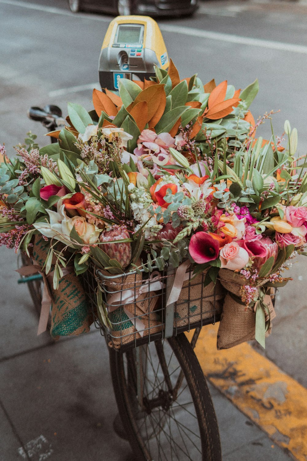 assorted-color flowers in bike basket