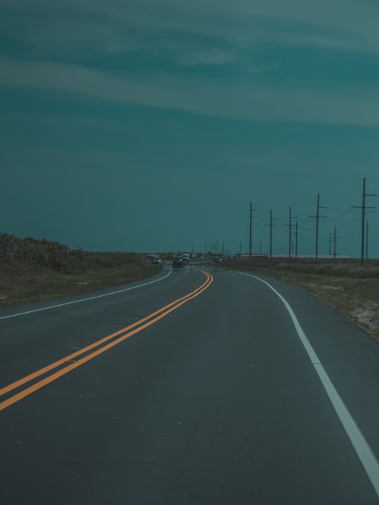 low light photography of asphalt road under cloudy sky in Rodanthe United States