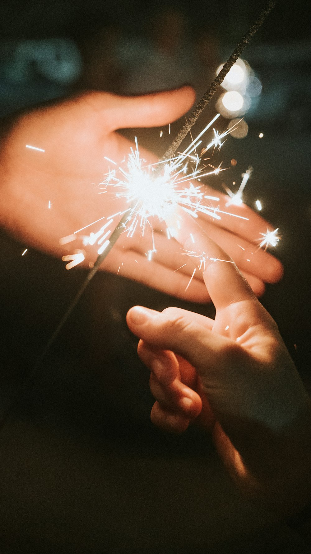 person holding fire cracker