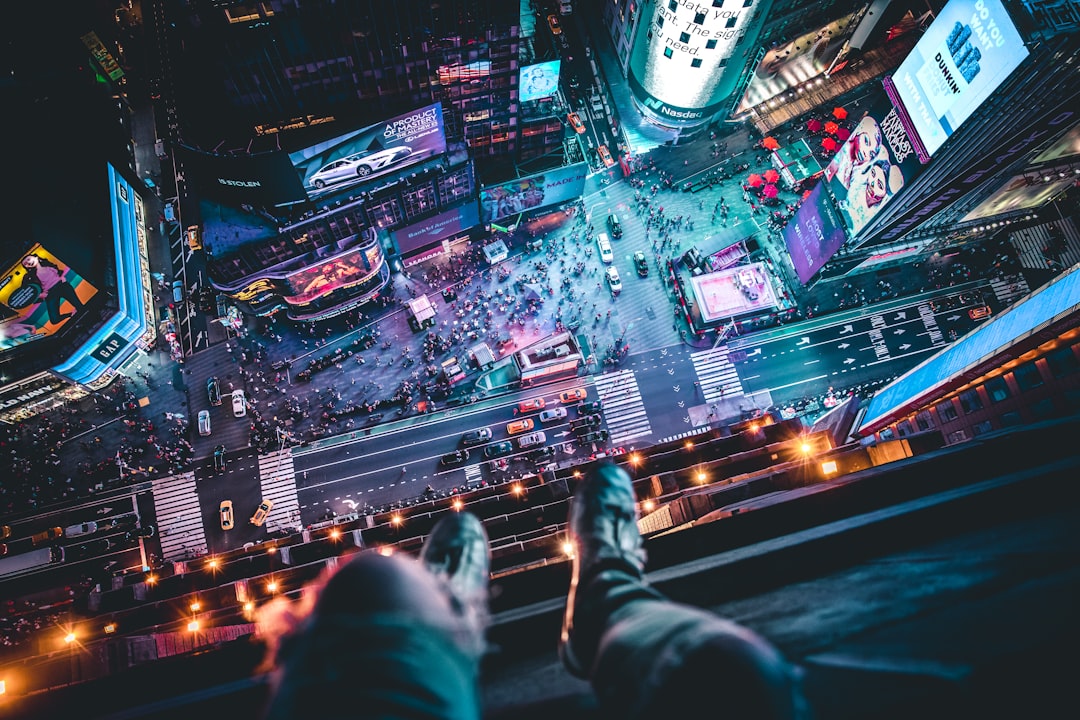 man sitting on building, Hangin’ above Time Square.