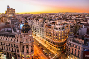 An aerial view of the Metropolis building and Gran Via in Madrid at low sun