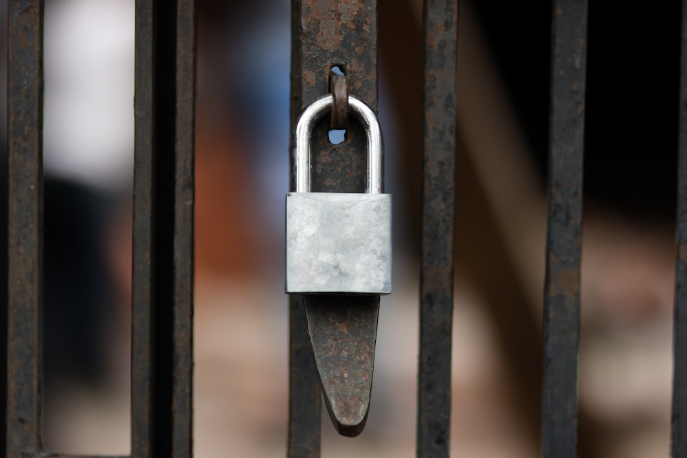 selective focus photo of gray padlock