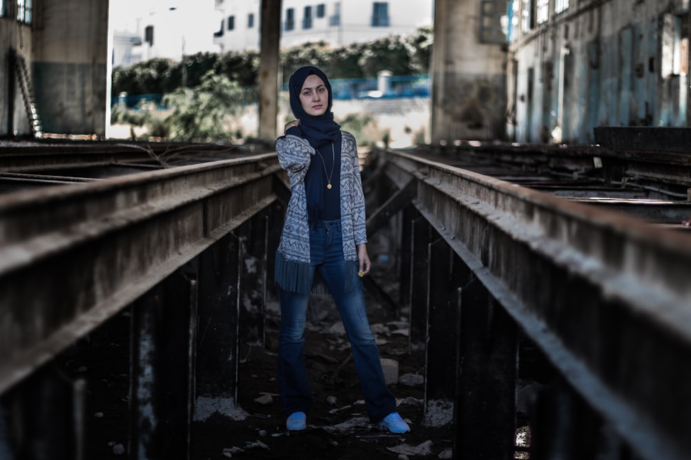 woman in blue jeans and black hijab headdress during daytime