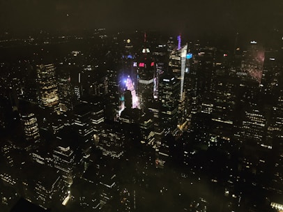 A creative digital billboard lighting up a city skyline at night.