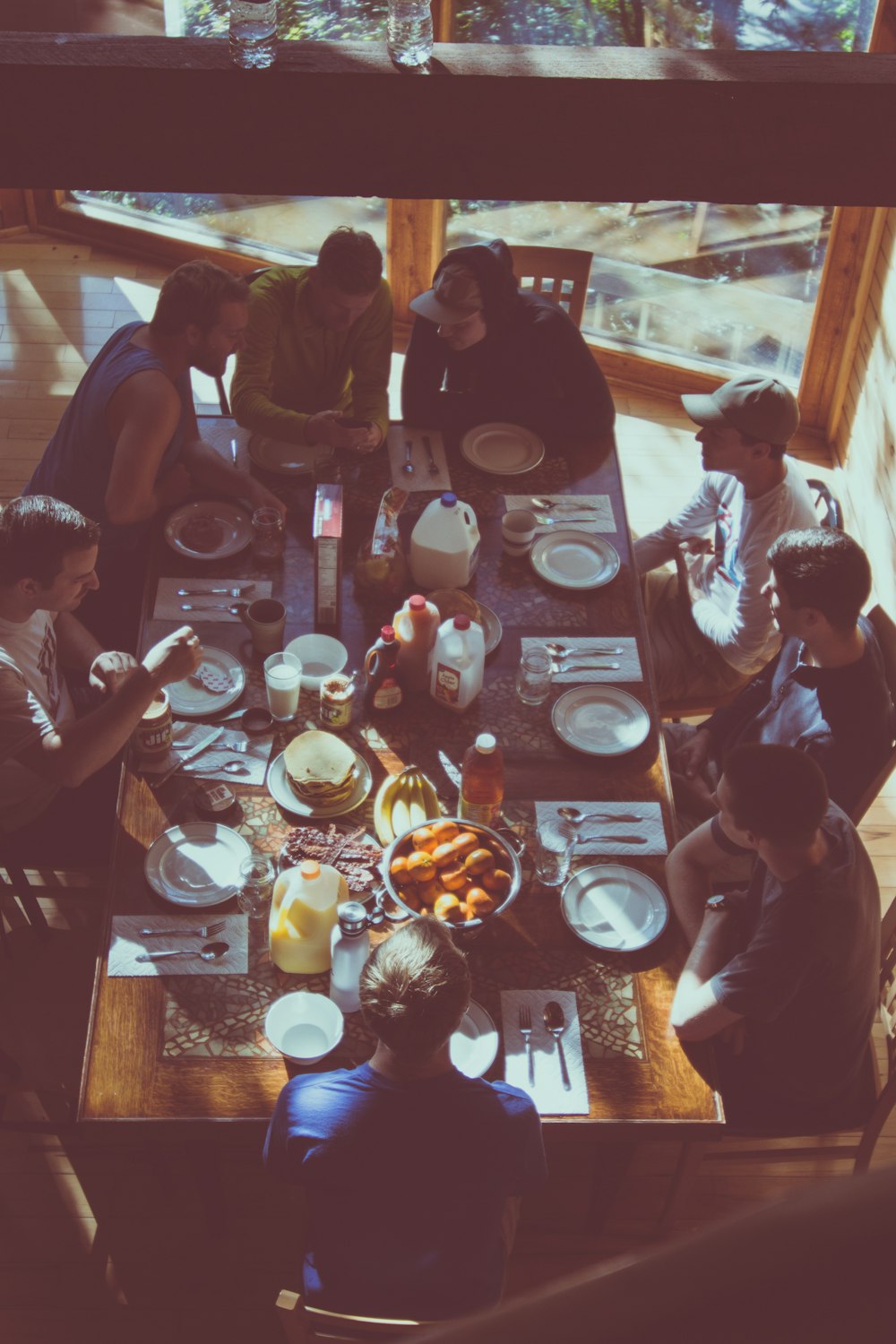 a group of people eating in a restaurant
