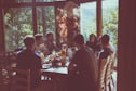 a group of people eating in a restaurant