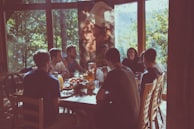 a group of people eating in a restaurant