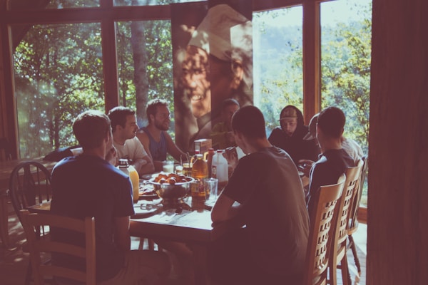 a group of people eating in a restaurant