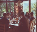 a group of people eating in a restaurant