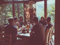 a group of people eating in a restaurant