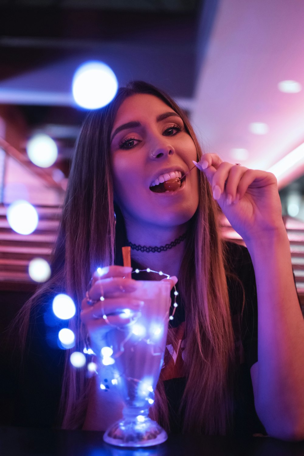 woman eating cherry