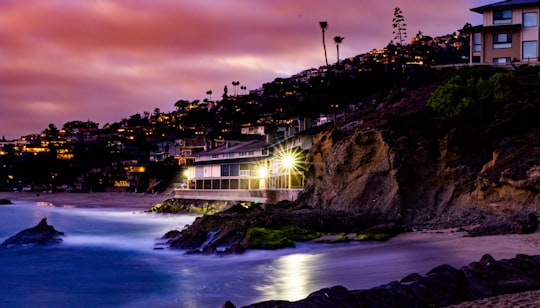white concrete house beside mountain in front body of water in Laguna Beach United States