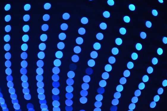 a close up of blue lights in the dark