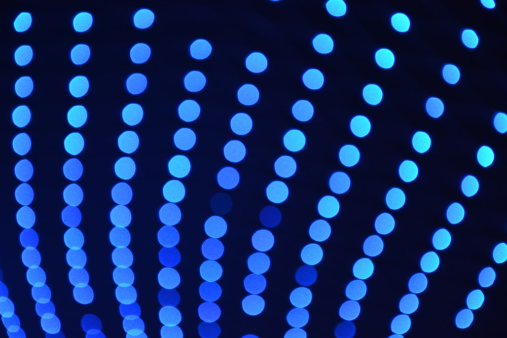a close up of blue lights in the dark