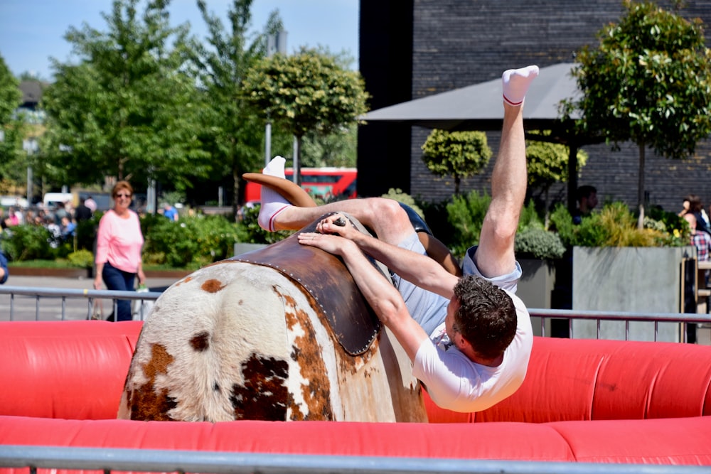 man riding mechanical bull