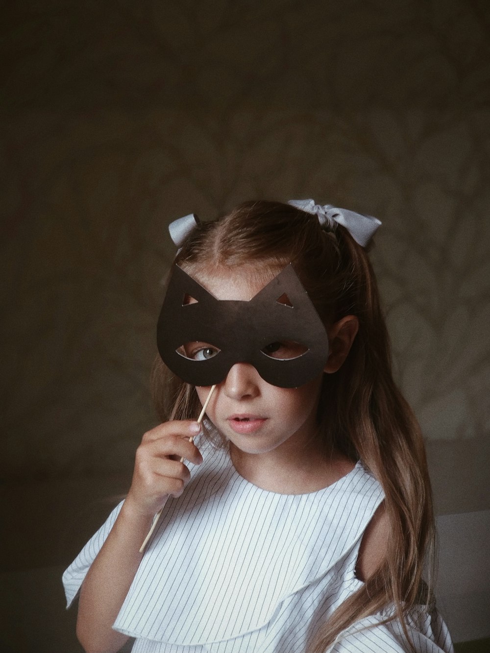 woman holding black eye mask