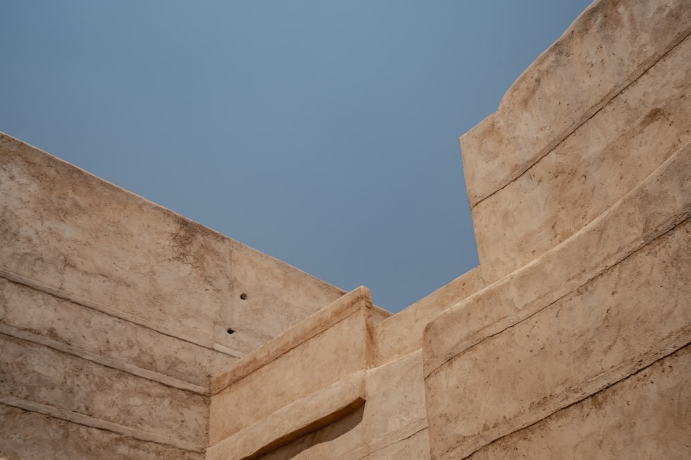 beige concrete building under blue sky during daytime